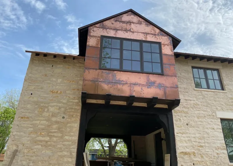 Copper metal panel facade on a stone building for Roof Repair in Arizona City