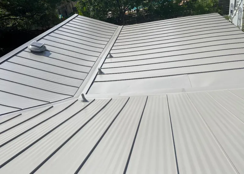 Solar attic fan installed on a metal roof for Roof Ventilation in Arizona City